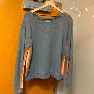 Gray cropped sweater, pink, white, and orange stripes along the sides